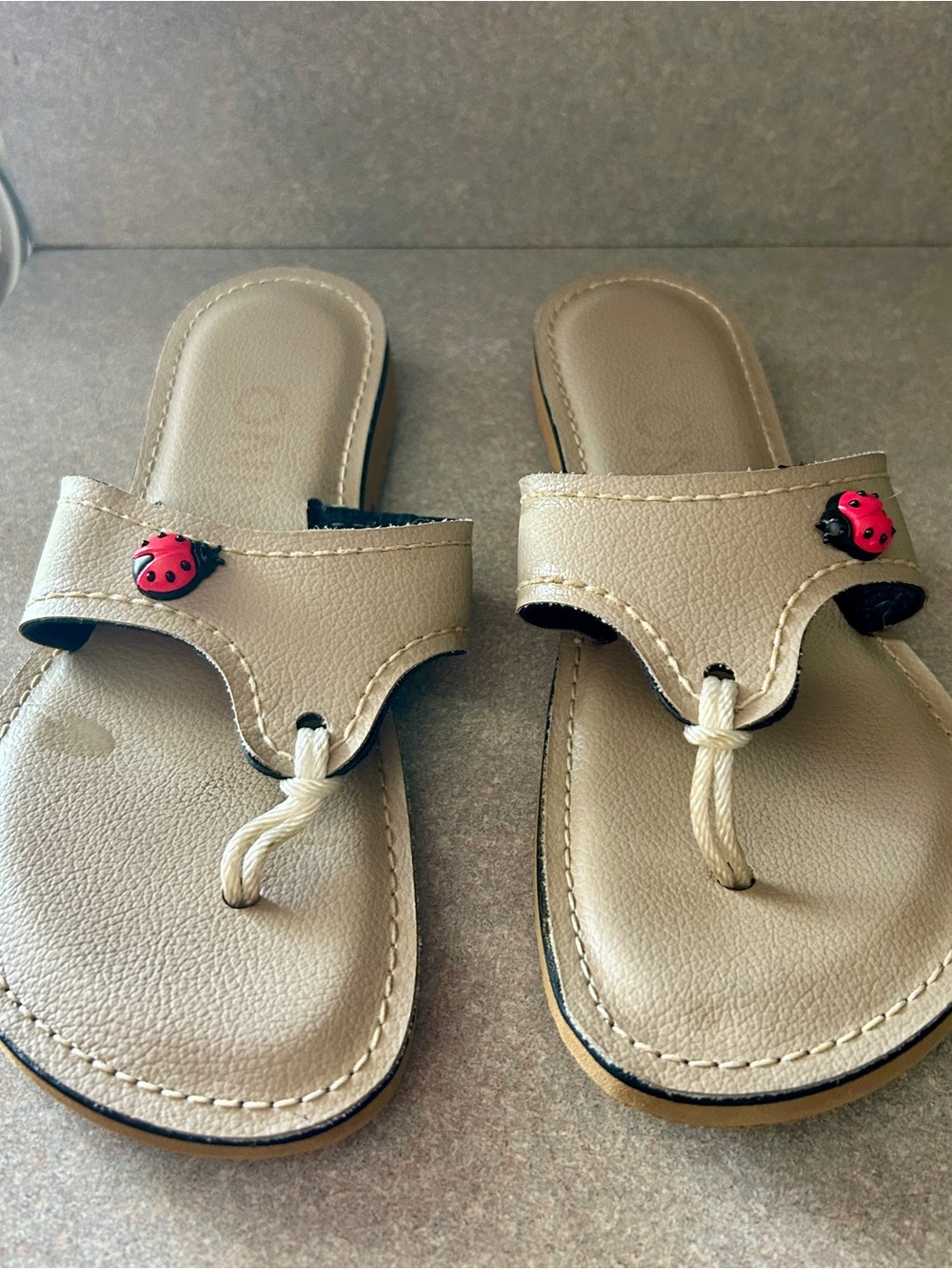 Kino cream Toe-Post Sandals with Ladybug Accent